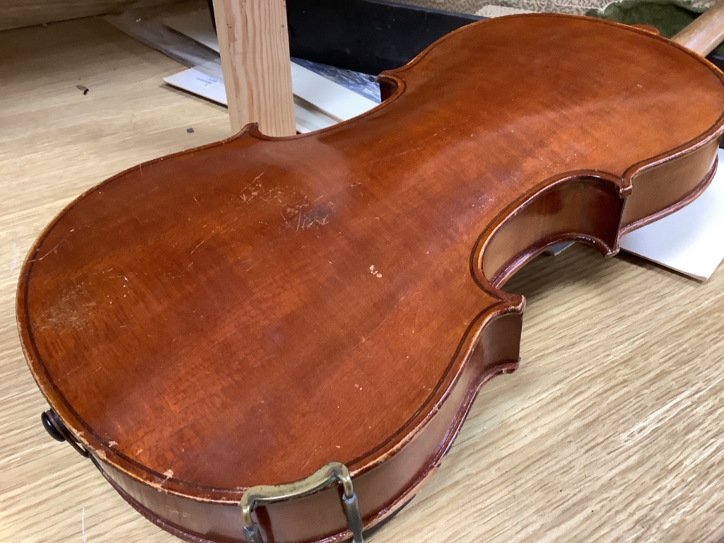 A violin and bow, in case, label to interior read Antonius Stadivarius Cremonensis, made in Czechoslovakia